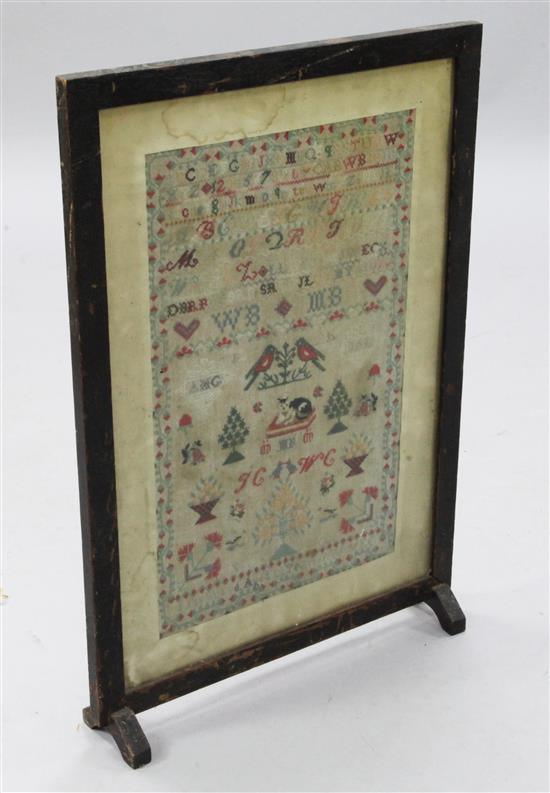 A Victorian needlework sampler, 20.5 x 12.5in., in fire screen frame